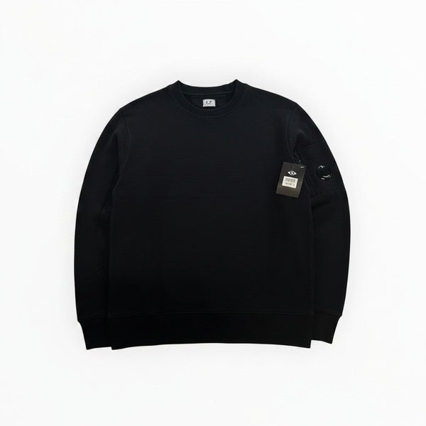Secondstore black C.P. Company crewneck sweatshirt featuring a signature lens detail on the utility sleeve pocket.