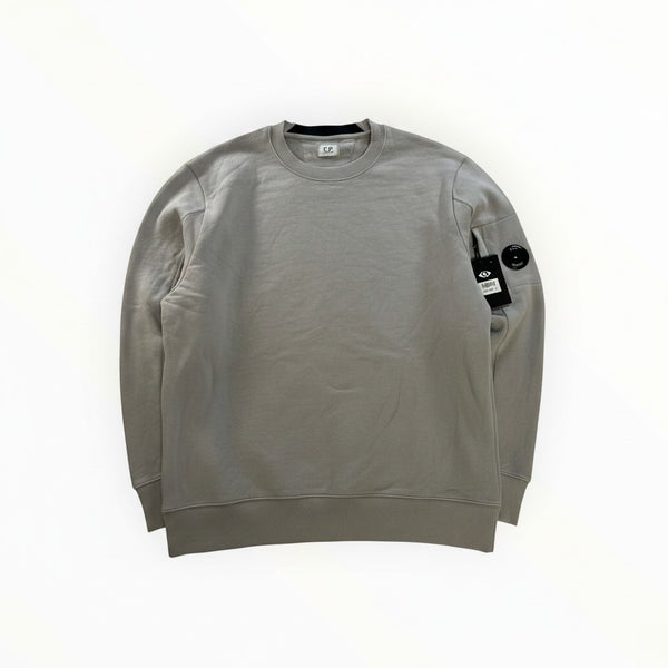 Secondstore C.P. Company grey cotton crew neck sweatshirt with signature lens detail on the zipped sleeve pocket.