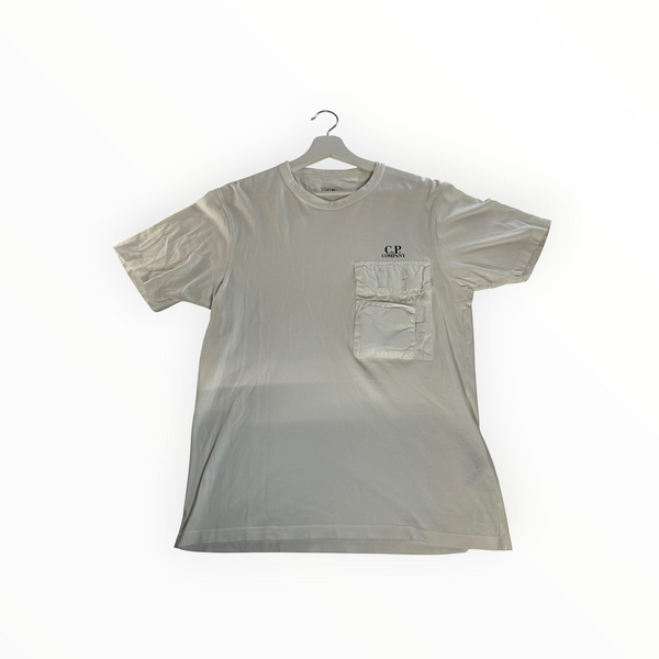 Secondstore off-white C.P. Company cotton t-shirt with a utilitarian chest pocket and logo branding on a hanger.
