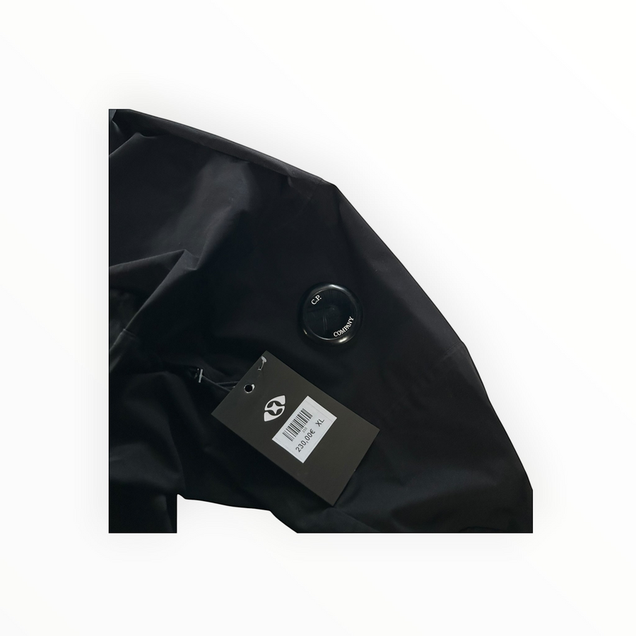 Veste noire Secondstore C.P. Company Pro-Tek avec lentille emblématique sur la manche et étiquette de prix