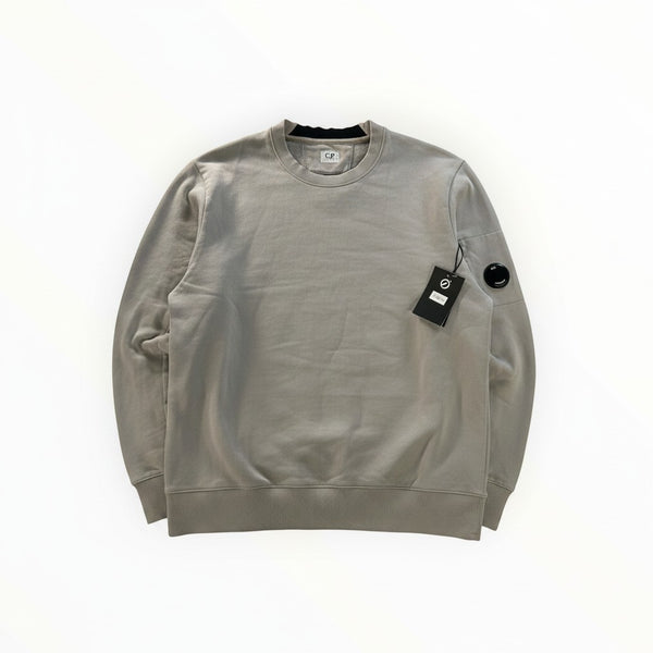 Secondstore grey C.P. Company crewneck sweatshirt in cotton with ribbed trim and iconic sleeve lens detail.