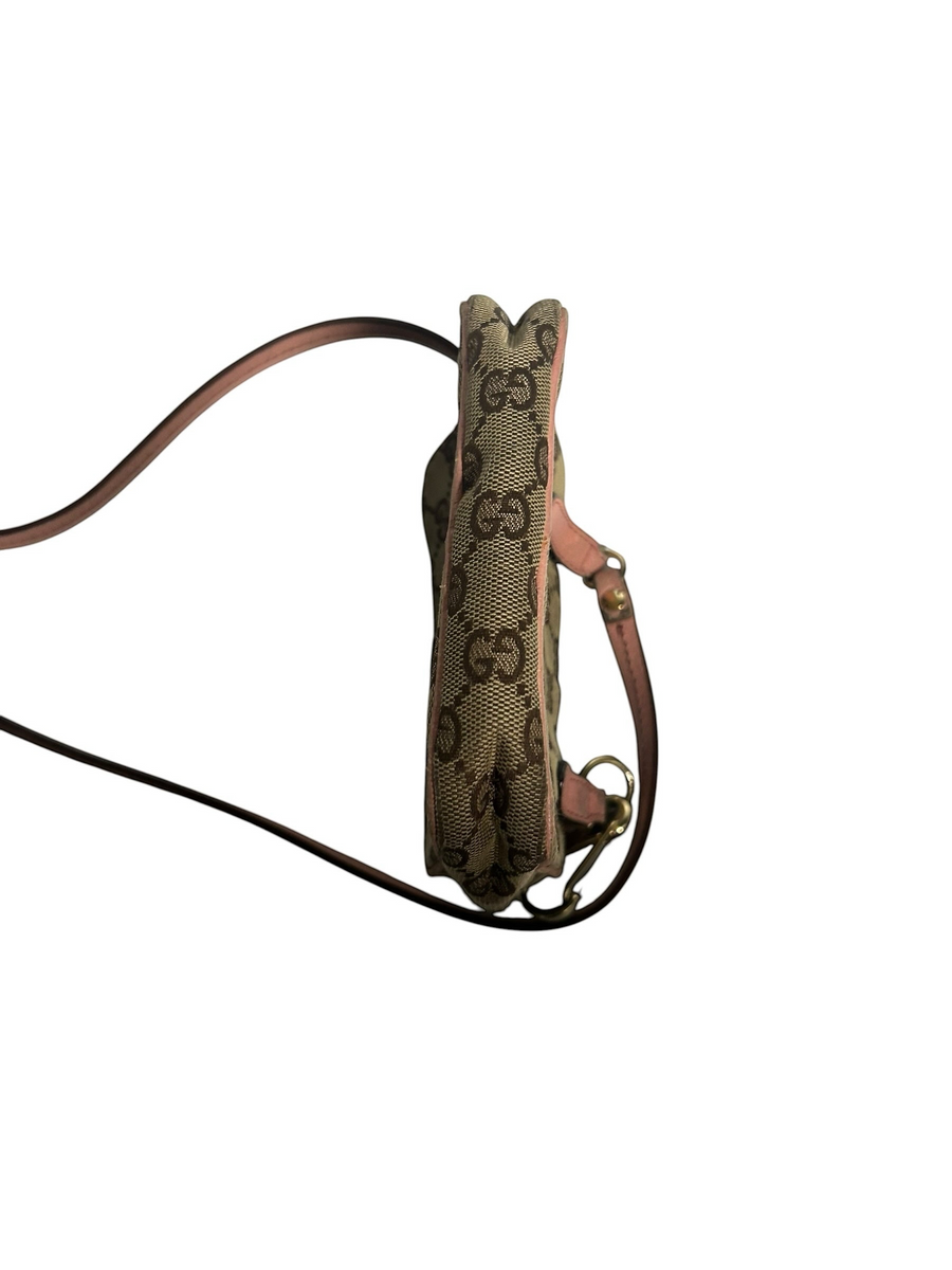 Secondstore Gucci monogram canvas crossbody bag with pink leather trim, shown from a side profile view.