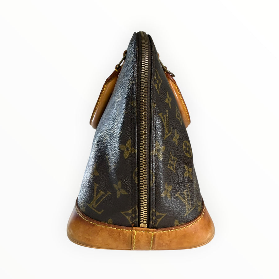 Vue latérale du sac à main Secondstore Louis Vuitton Alma en toile Monogram avec finitions en cuir naturel