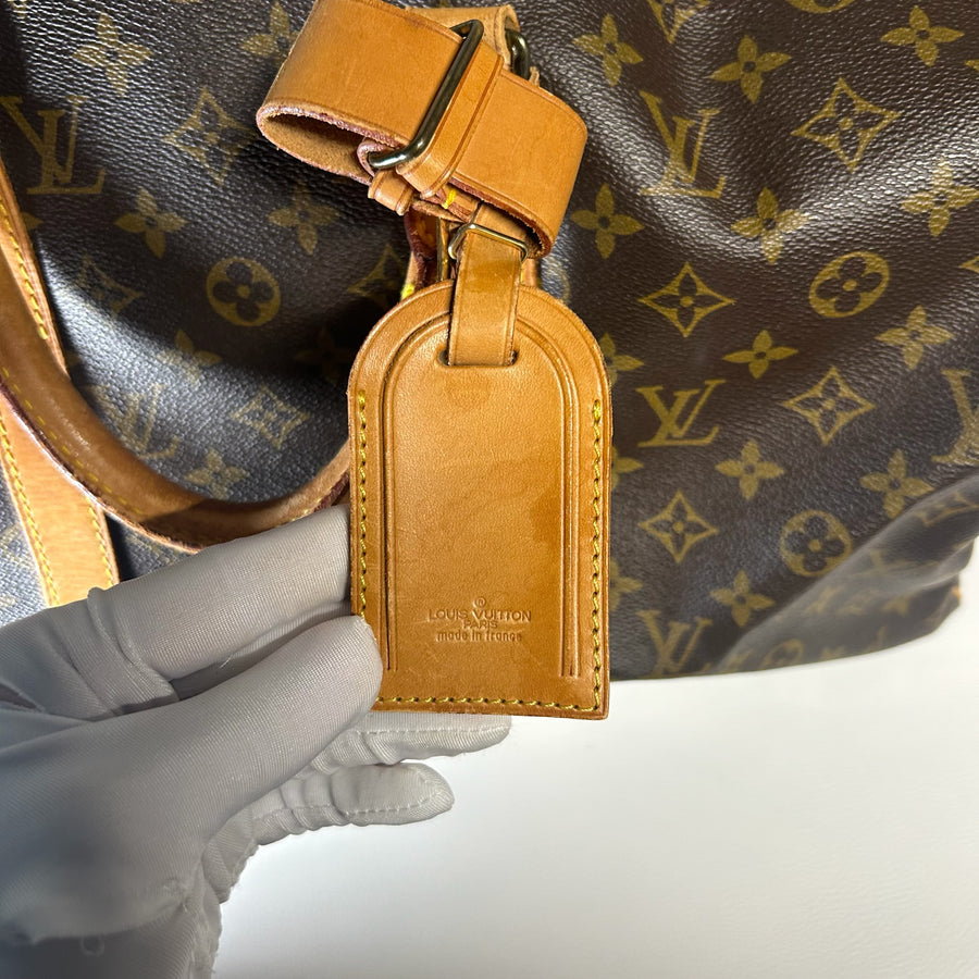 Porte-adresse en cuir naturel sur sac de voyage Secondstore Louis Vuitton Keepall en toile Monogram