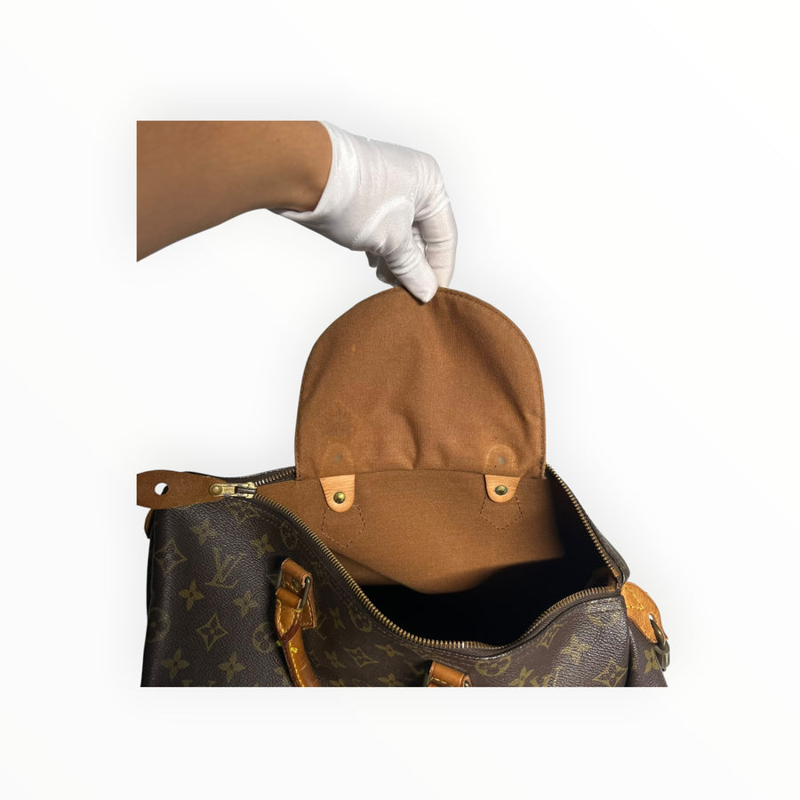 Intérieur du sac Secondstore Louis Vuitton Speedy en toile Monogram marron avec doublure textile et détails en cuir