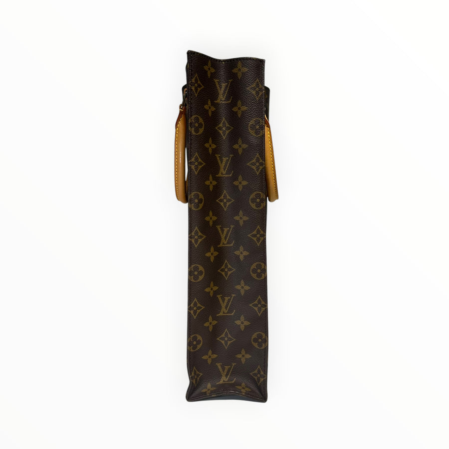 Vue latérale du sac cabas Secondstore Louis Vuitton en toile Monogram marron avec anses en cuir naturel
