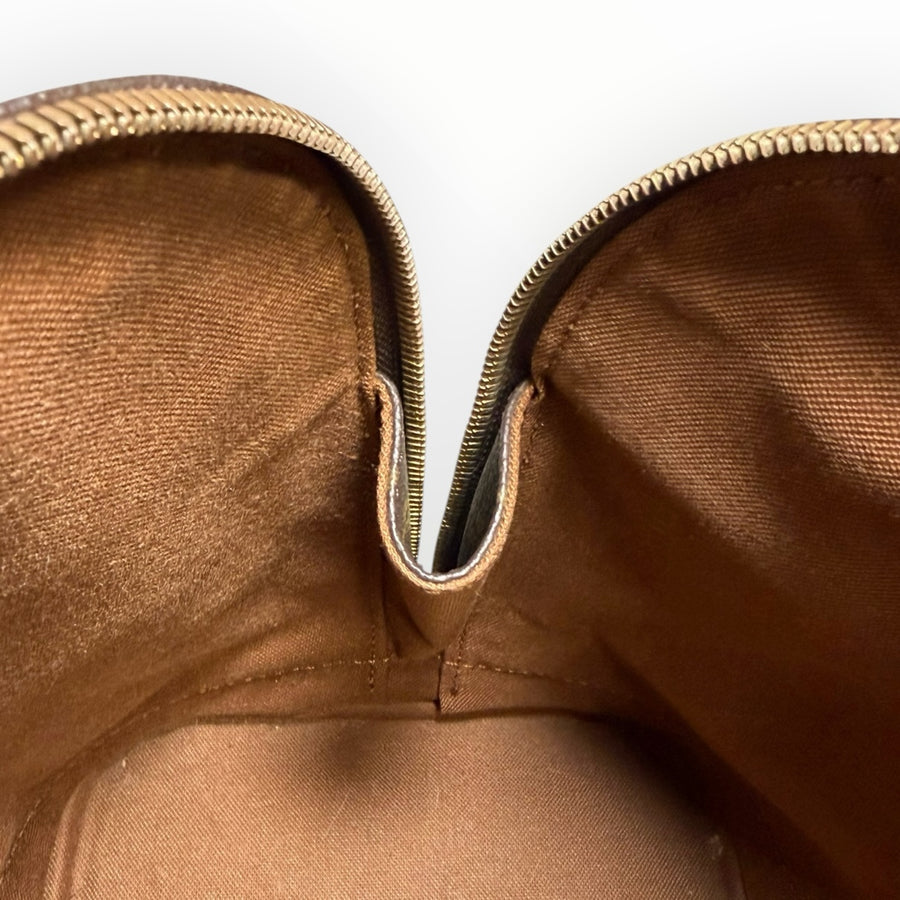Intérieur spacieux en textile marron du sac à main Secondstore Louis Vuitton Alma avec fermeture éclair dorée