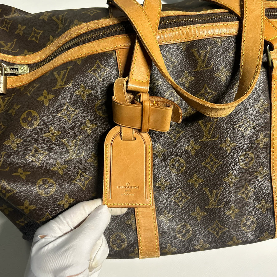 Sac de voyage Secondstore Louis Vuitton Keepall en toile Monogram marron avec étiquette porte-adresse en cuir naturel