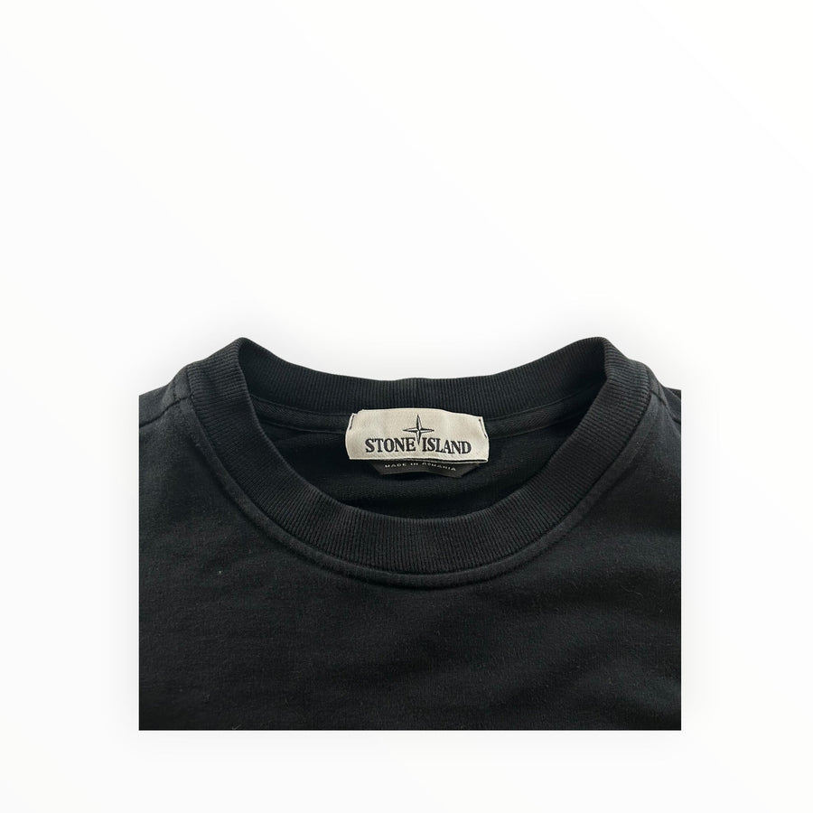 Secondstore black Stone Island crewneck sweatshirt featuring the iconic brand label on the inner collar.