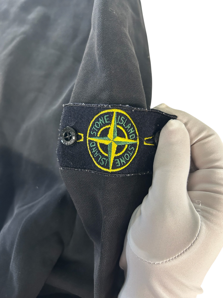 Secondstore Stone Island black cotton sweatshirt sleeve featuring the iconic embroidered compass logo patch