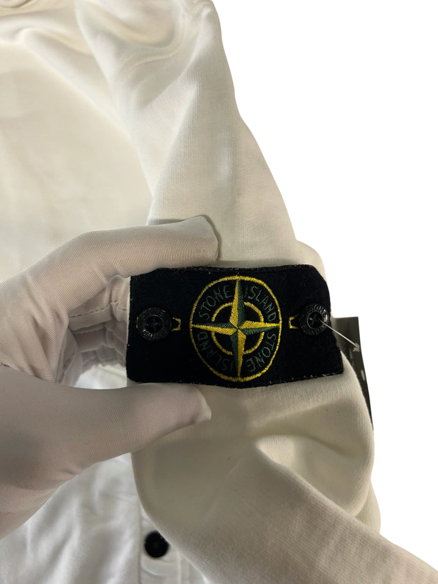 Secondstore white cotton hoodie sleeve featuring the iconic embroidered Stone Island compass patch with button detail