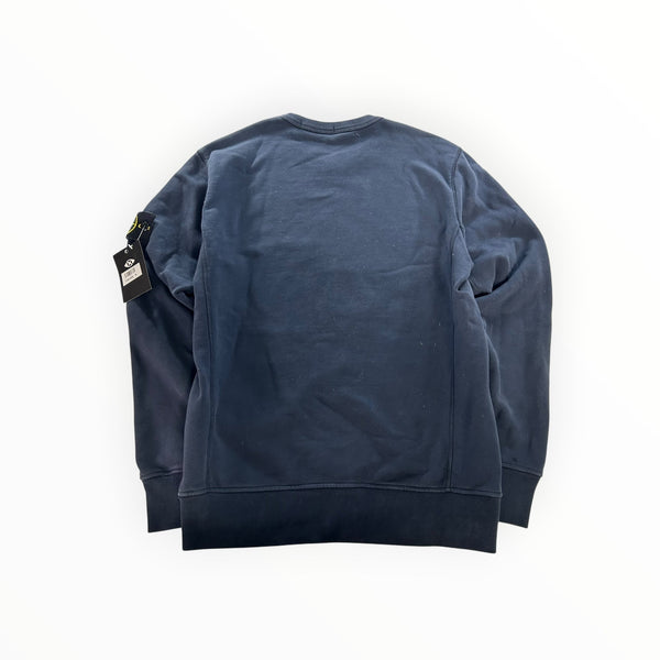 Secondstore navy blue Stone Island crewneck sweatshirt with iconic compass patch on the sleeve, back view.