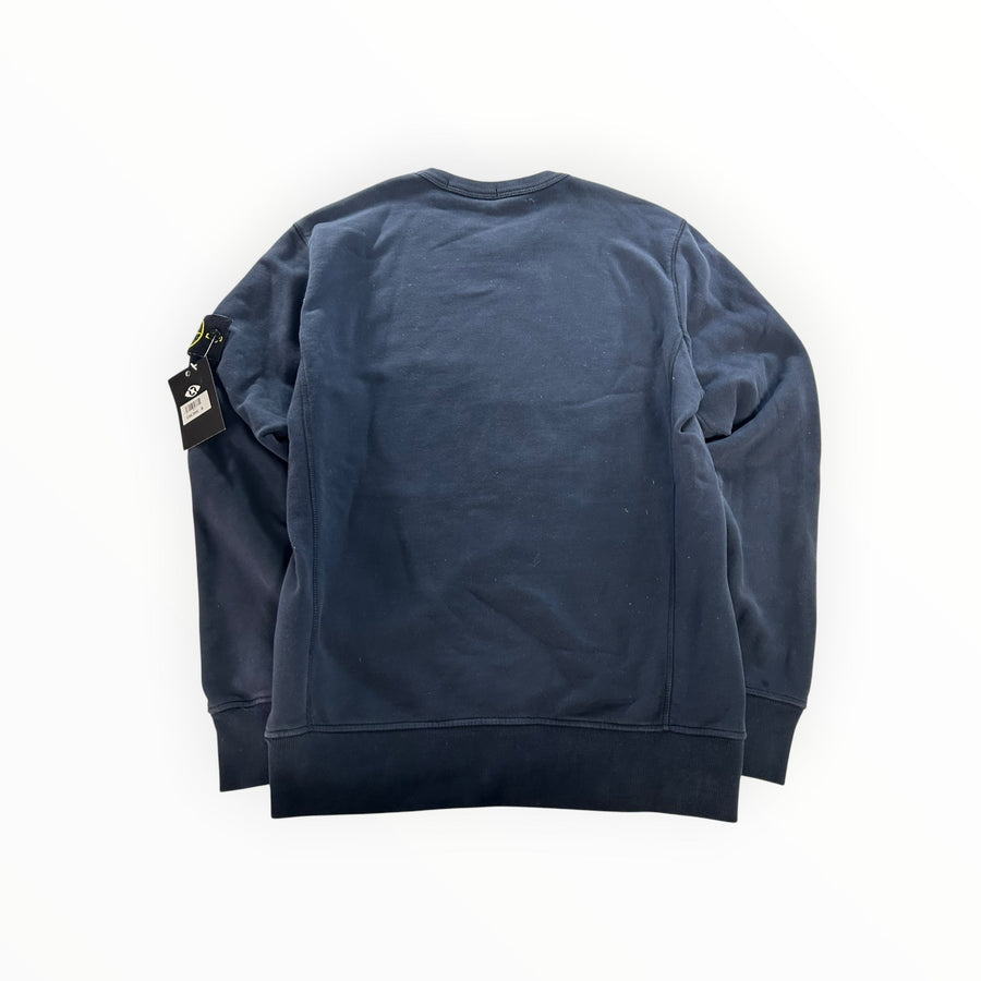Secondstore navy blue Stone Island crewneck sweatshirt with iconic compass patch on the sleeve, back view.