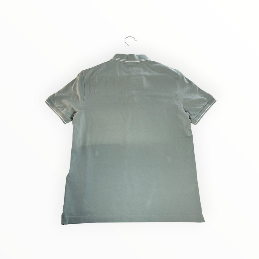Back view of a sage green Secondstore Stone Island cotton pique polo shirt with contrast tipping on collar and sleeves.