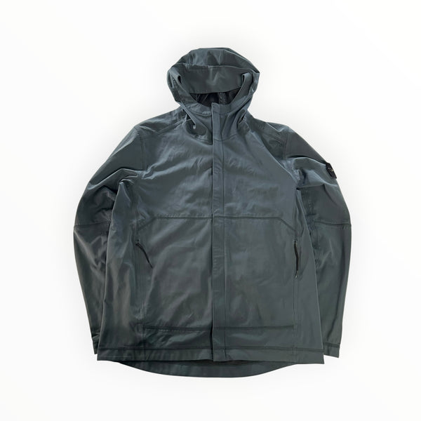 Secondstore Stone Island light soft shell hooded jacket in dark grey with signature compass badge and zip pockets.
