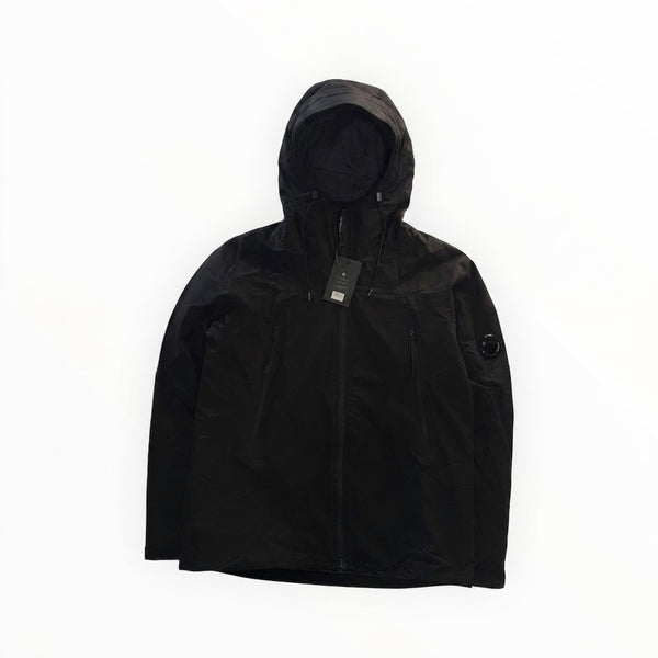 Veste technique noire Secondstore C.P. Company en tissu Pro-Tek avec capuche et lentille emblématique sur la manche
