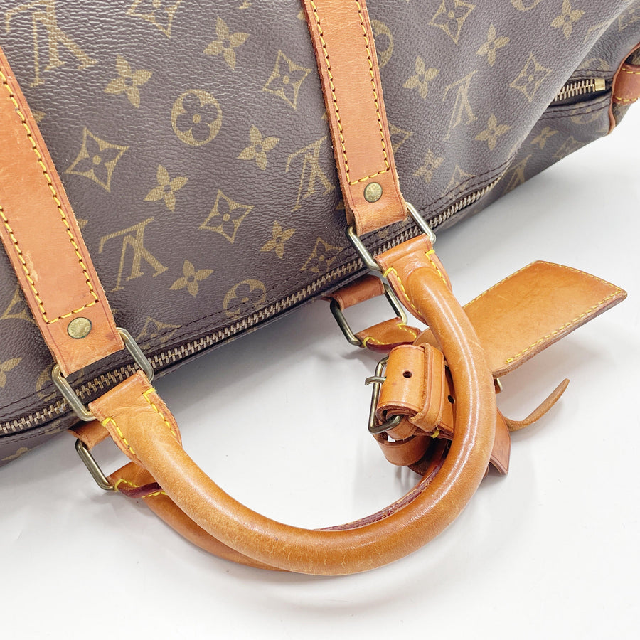 Secondstore Louis Vuitton Keepall 55 travel bag in brown Monogram canvas with worn natural leather handles