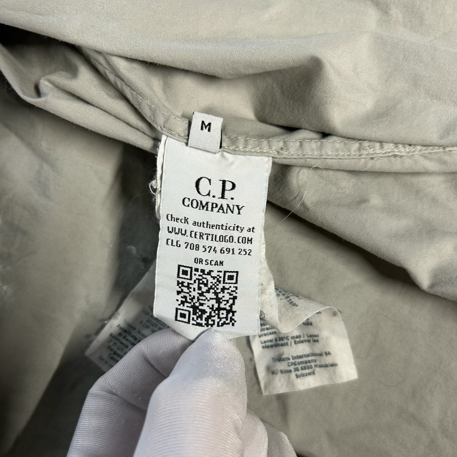 Secondstore C.P. Company overshirt interior authenticity label with QR code and Certilogo details on light grey fabric