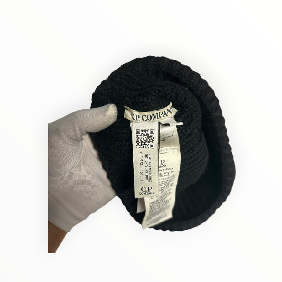 Secondstore C.P. COMPANY black ribbed beanie hat showing interior brand label and authentication QR code tag