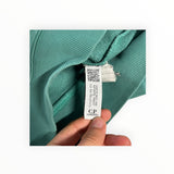 Étiquette d'authenticité avec code QR à l'intérieur du sweat-shirt vert émeraude Secondstore C.P. Company
