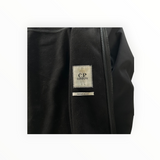 Secondstore C.P. Company Goggle Jacket interior showing black fleece lining and branded label
