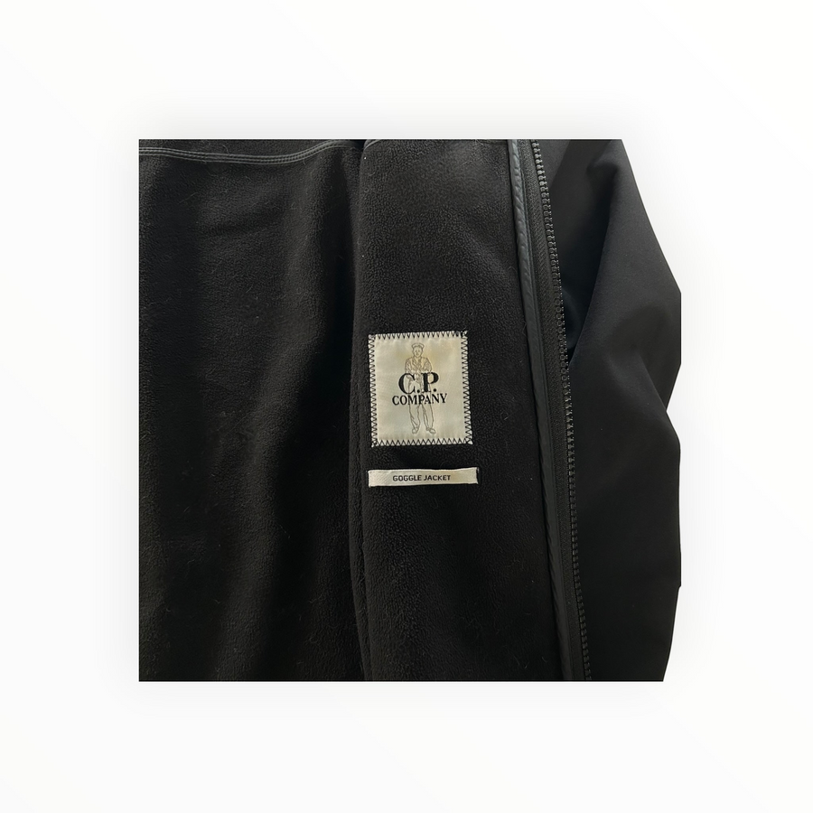 Secondstore C.P. Company Goggle Jacket interior showing black fleece lining and branded label