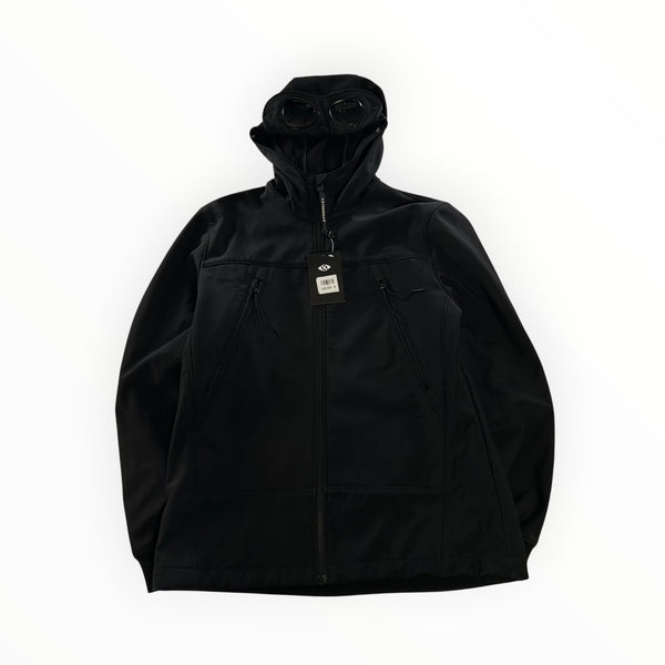 Veste noire Secondstore C.P. Company Goggle en tissu technique avec capuche à lunettes intégrées et poches zippées.