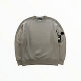 Secondstore C.P. Company grey crewneck sweatshirt in soft cotton with signature sleeve lens pocket and ribbed trim.