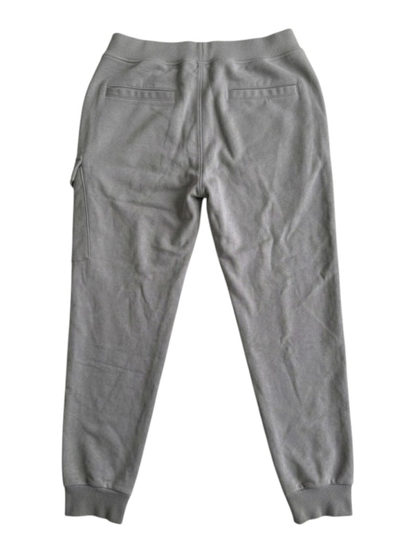 Secondstore grey C.P Company jogging pants featuring a back view with ribbed cuffs and side cargo pocket detail.