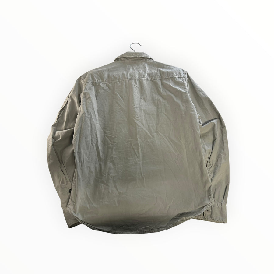 Back view of a light grey Secondstore C.P. Company zip up overshirt with long sleeves and a classic collar.