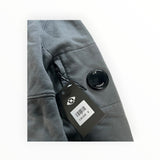 Secondstore C.P. Company charcoal grey cotton hooded sweatshirt sleeve with iconic black lens detail and retail tag