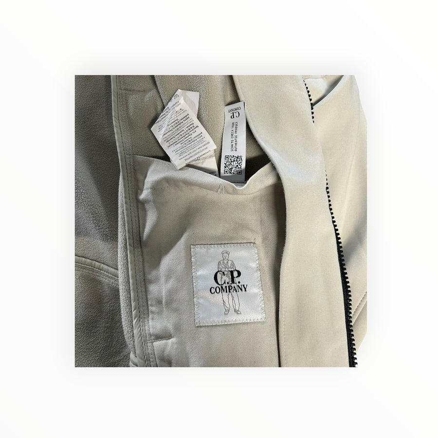 Secondstore C.P. Company beige soft shell jacket interior label and fleece lining detail