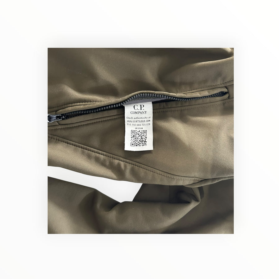 Secondstore C.P. Company olive green soft shell jacket interior label with Certilogo QR code and zipper detail