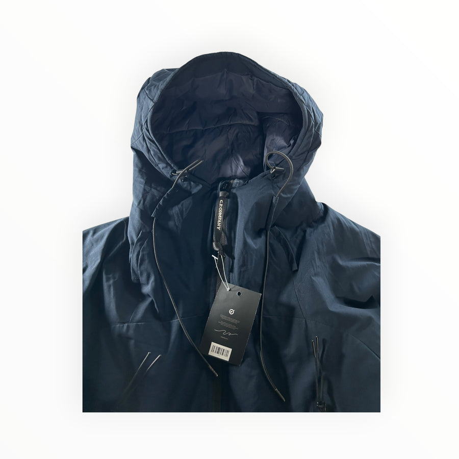 Secondstore navy blue C.P. Company Pro-Tek hooded jacket with drawstring hood and technical water-resistant fabric.