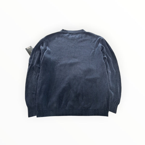 Secondstore navy blue C.P. Company ribbed knit crewneck sweater with long sleeves and ribbed cuffs, back view.
