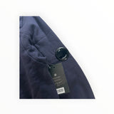 Secondstore navy blue C.P. Company cotton sweatshirt featuring the signature lens detail on the sleeve with tags