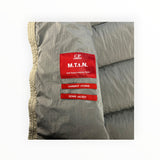 Secondstore C.P. Company padded down vest interior showing red M.T.t.N. nylon fabric labels and quilted texture