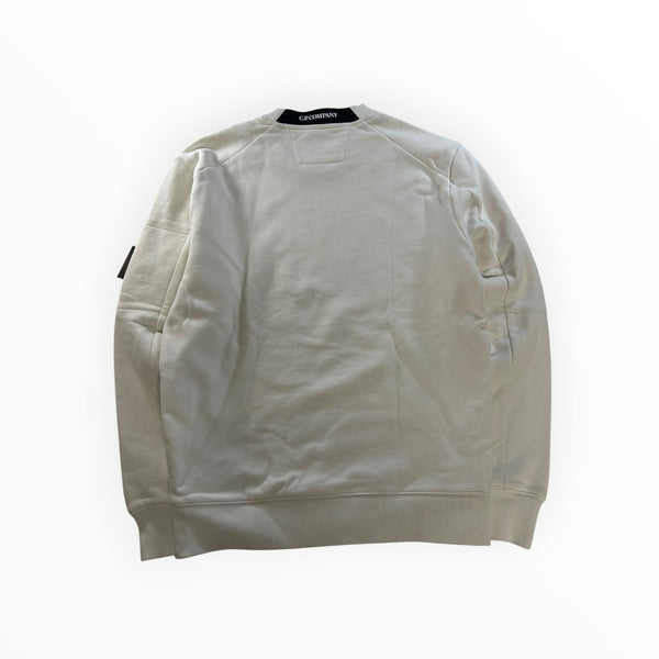 Secondstore C.P. Company off-white cotton crewneck sweatshirt with signature lens sleeve pocket and ribbed trim.