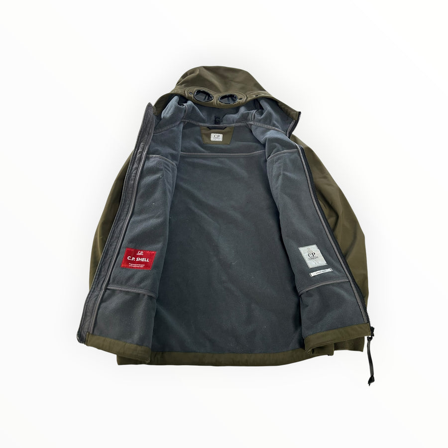 Secondstore C.P. Company olive green soft shell jacket with fleece lining and iconic hood goggles, interior view.
