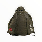 Secondstore C.P. Company olive green Goggle Jacket with quilted interior, integrated hood goggles, and zip closure.