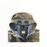 Secondstore C.P. Company olive green soft shell jacket with iconic integrated hood goggles and fleece lining