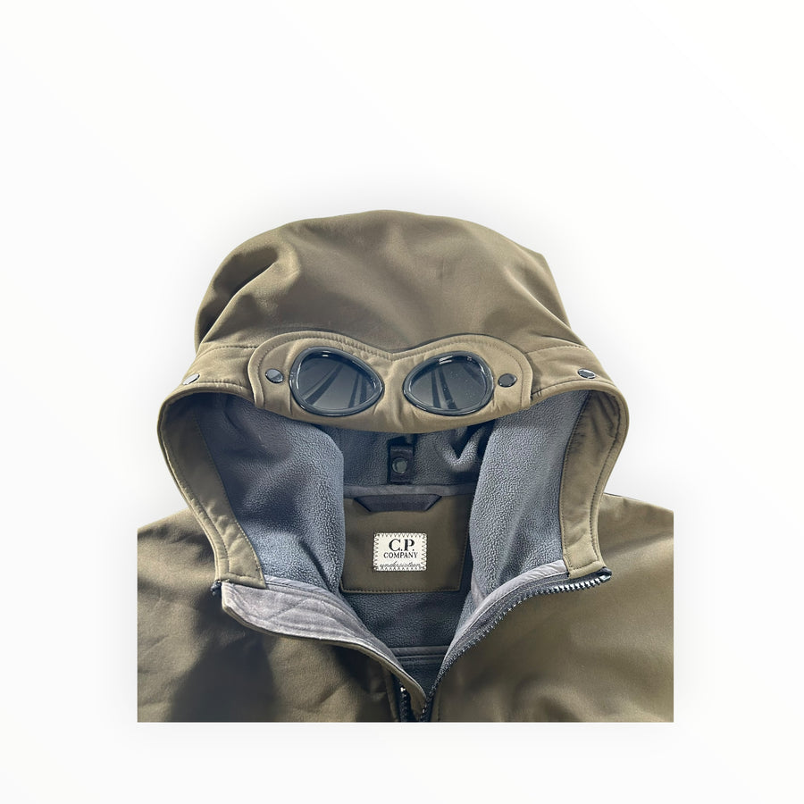 Secondstore C.P. Company olive green soft shell jacket with iconic integrated hood goggles and fleece lining