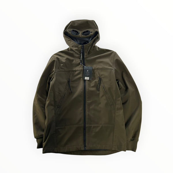 Secondstore olive green C.P. Company soft shell jacket with signature integrated hood goggles and front zip pockets.