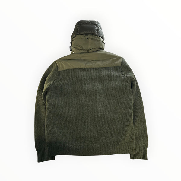Back view of a Secondstore C.P. Company olive green hybrid down jacket with a goggle hood and textured knit sleeves.