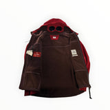 Secondstore red C.P. Company Goggle Jacket in CP Shell fabric with integrated hood goggles and brown fleece lining.