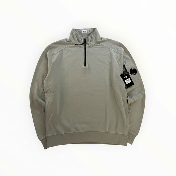 Secondstore sage-grey C.P. Company cotton quarter-zip sweatshirt with signature sleeve lens pocket and ribbed trim.