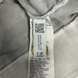 Secondstore C.P. Company sweatshirt internal care label with authenticity QR code and branding on grey cotton fabric