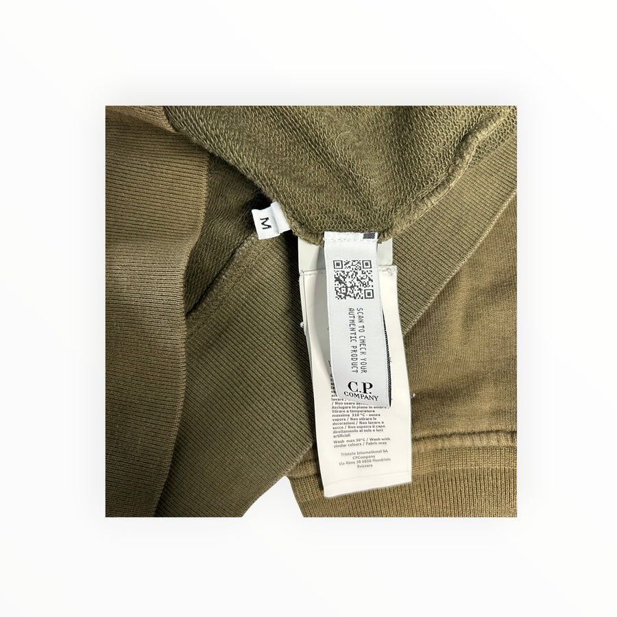 Secondstore C.P. Company olive-khaki cotton sweatshirt interior label and size M tag showing authenticity details