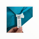 Secondstore C.P. Company teal sweatshirt interior label with QR code for authenticity verification