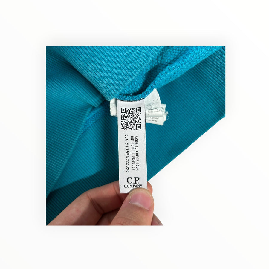 Secondstore C.P. Company teal sweatshirt interior label with QR code for authenticity verification